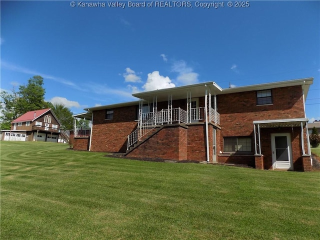 101 Ebony Dr, Cross Lanes, WV 25313 - rear view of house featuring a yard, brick siding, and stairway