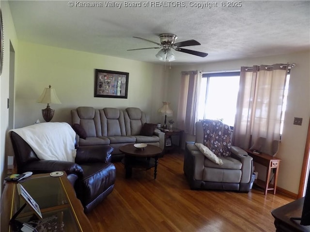 101 Ebony Dr, Cross Lanes, WV 25313 - living room with wood finished floors, a ceiling fan, and a textured ceiling