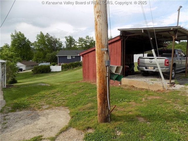 101 Ebony Dr, Cross Lanes, WV 25313 - view of green lawn with a carport