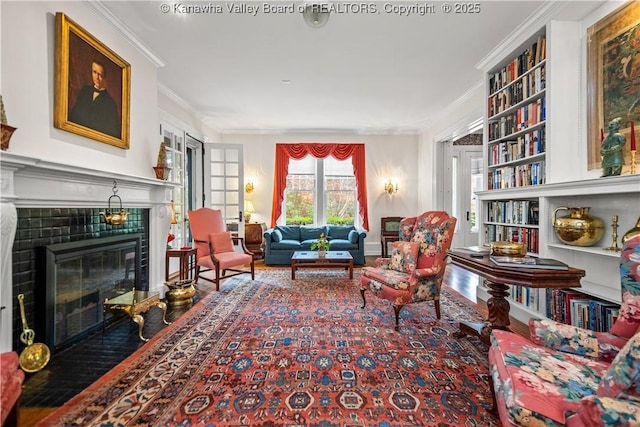 1223 Staunton Rd, Charleston, WV 25314 - sitting room featuring ornamental molding, a fireplace, built in features, and wood finished floors