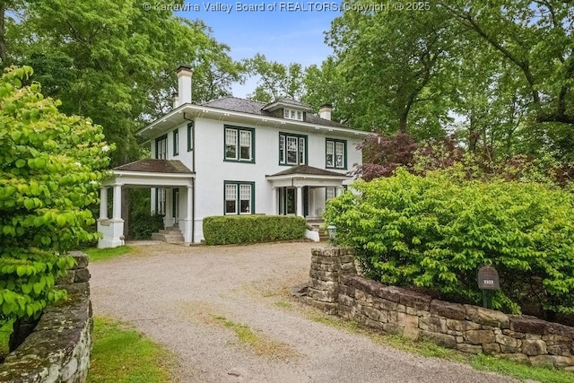 1223 Staunton Rd, Charleston, WV 25314 - traditional style home featuring a chimney, stucco siding, and dirt driveway
