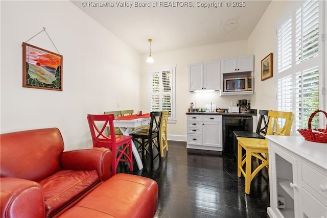 1223 Staunton Rd, Charleston, WV 25314 - kitchen featuring stainless steel microwave, dark wood-style flooring, white cabinets, dishwasher, and baseboards