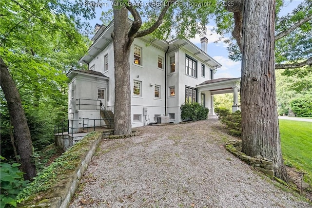 1223 Staunton Rd, Charleston, WV 25314 - view of front of home featuring stucco siding and a chimney