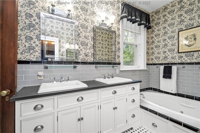 1223 Staunton Rd, Charleston, WV 25314 - full bath featuring wallpapered walls, wainscoting, double vanity, a whirlpool tub, and tile walls