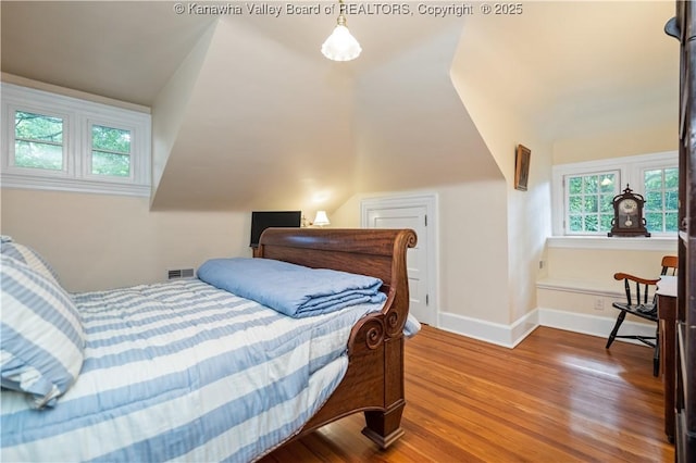 1223 Staunton Rd, Charleston, WV 25314 - bedroom with wood finished floors, baseboards, and vaulted ceiling