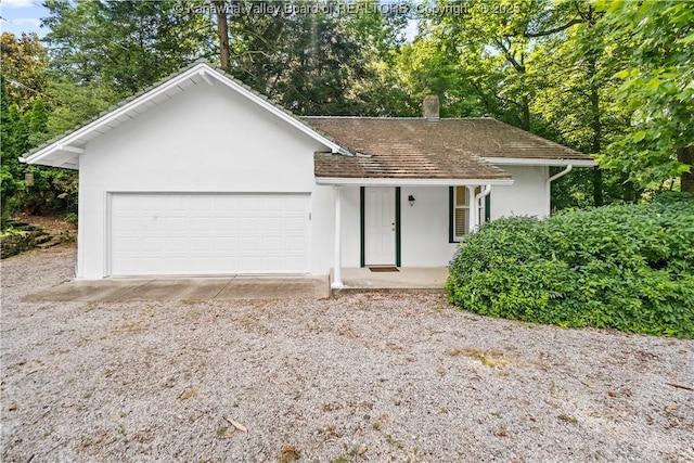 1223 Staunton Rd, Charleston, WV 25314 - ranch-style house featuring stucco siding, a chimney, an attached garage, a porch, and roof with shingles