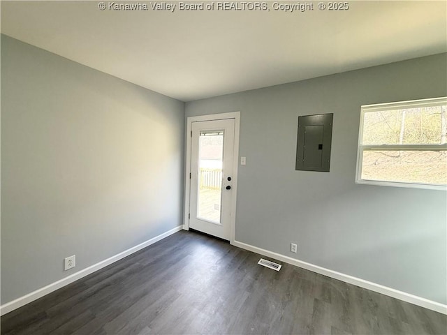 202 Josephine Ave, Madison, WV 25130 - unfurnished room with electric panel, baseboards, and dark wood finished floors
