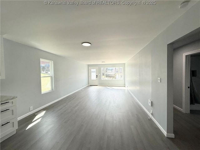 202 Josephine Ave, Madison, WV 25130 - unfurnished living room with dark wood-type flooring and baseboards
