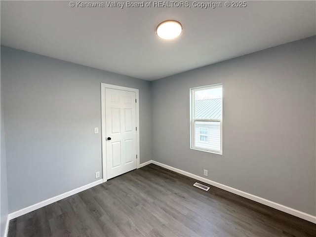 202 Josephine Ave, Madison, WV 25130 - empty room featuring dark wood finished floors and baseboards