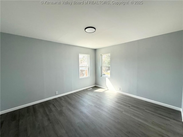 202 Josephine Ave, Madison, WV 25130 - empty room with dark wood-type flooring and baseboards
