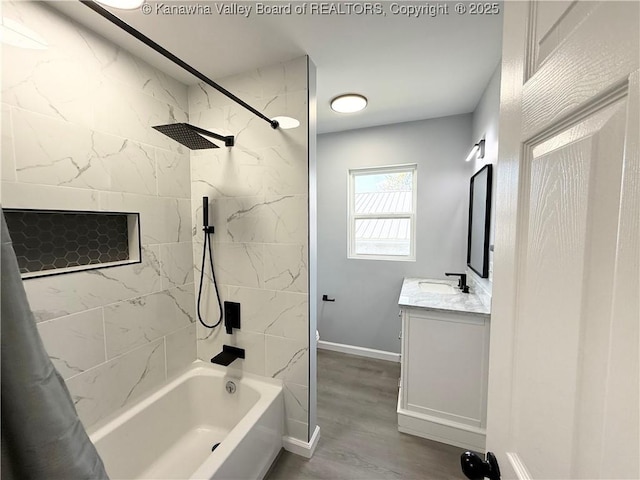 202 Josephine Ave, Madison, WV 25130 - bathroom featuring shower / bath combination with curtain, vanity, baseboards, and wood finished floors
