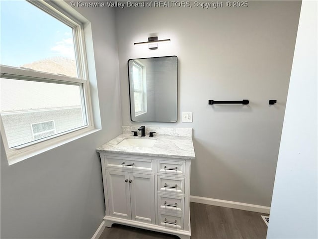 202 Josephine Ave, Madison, WV 25130 - bathroom featuring baseboards, vanity, and wood finished floors