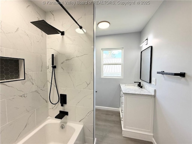 202 Josephine Ave, Madison, WV 25130 - full bath featuring vanity, tub / shower combination, baseboards, and wood finished floors