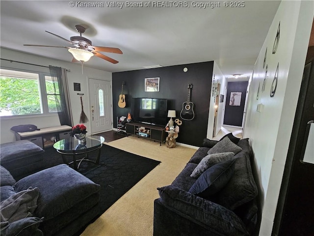 1000 Park Dr, Dunbar, WV 25064 - carpeted living room featuring a ceiling fan and baseboards