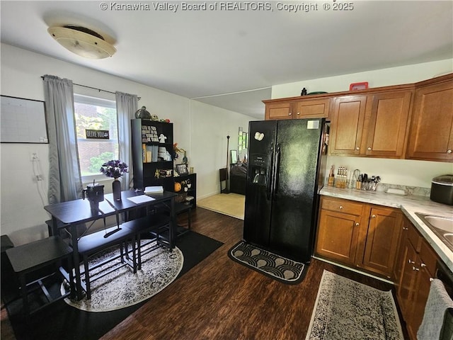 1000 Park Dr, Dunbar, WV 25064 - kitchen featuring black refrigerator with ice dispenser, dark wood-style floors, light countertops, brown cabinetry, and a desk