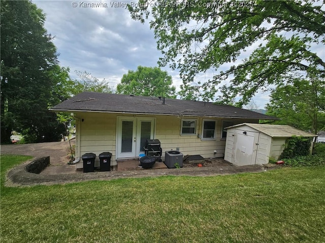 1000 Park Dr, Dunbar, WV 25064 - back of property featuring a storage unit, cooling unit, a yard, and an outdoor structure