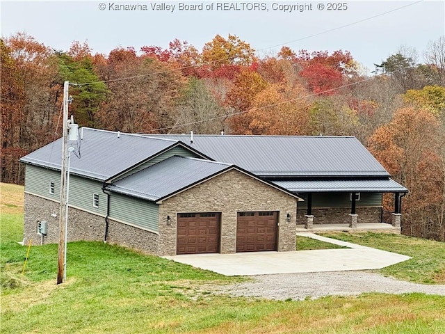 2885 Emma Rd, Given, WV 25245 - ranch-style house with stone siding, concrete driveway, an attached garage, a front yard, and covered porch