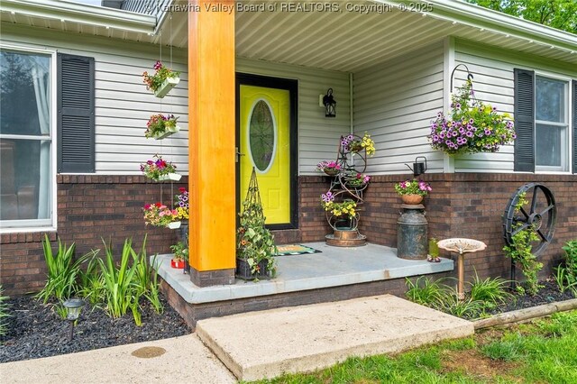 3589 Mount Union Rd, Fraziers Bottom, WV 25082 - entrance to property with a porch and brick siding