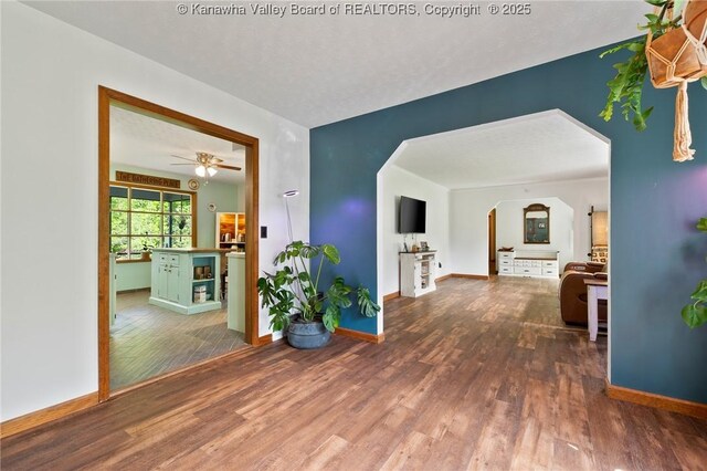 3589 Mount Union Rd, Fraziers Bottom, WV 25082 - hall with wood finished floors, arched walkways, and baseboards