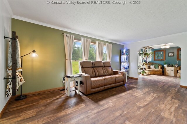 3589 Mount Union Rd, Fraziers Bottom, WV 25082 - living room featuring a chandelier, crown molding, wood finished floors, baseboards, and arched walkways