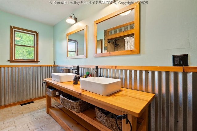 3589 Mount Union Rd, Fraziers Bottom, WV 25082 - bathroom featuring a wainscoted wall, double vanity, and a shower with shower curtain