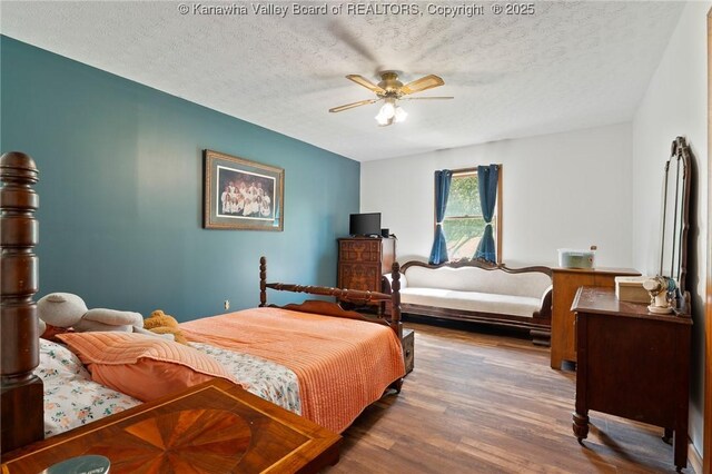 3589 Mount Union Rd, Fraziers Bottom, WV 25082 - bedroom featuring wood finished floors, a textured ceiling, and ceiling fan