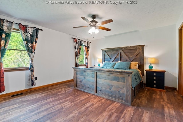 3589 Mount Union Rd, Fraziers Bottom, WV 25082 - bedroom with wood finished floors, baseboards, a textured ceiling, and a ceiling fan