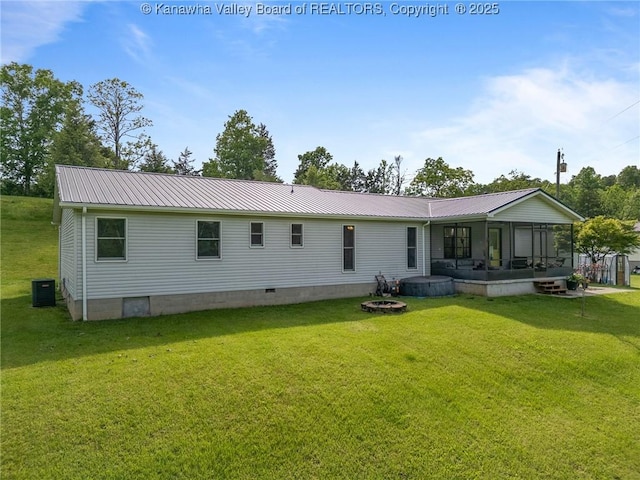 3589 Mount Union Rd, Fraziers Bottom, WV 25082 - rear view of property featuring a sunroom, a lawn, metal roof, and crawl space
