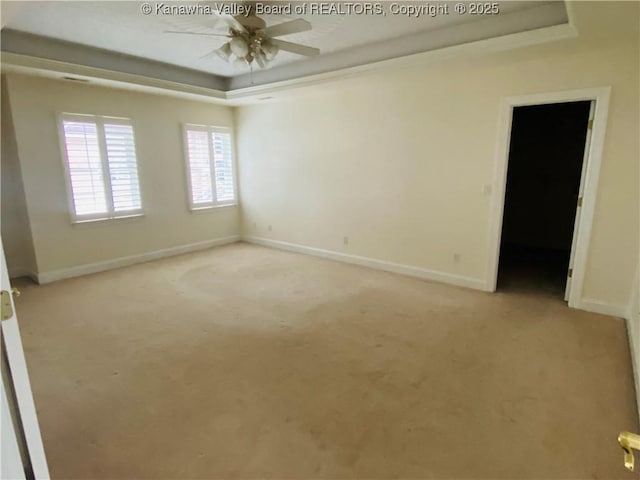 516 Woodbridge Dr, Charleston, WV 25311 - unfurnished room featuring a raised ceiling, ceiling fan, light colored carpet, and baseboards