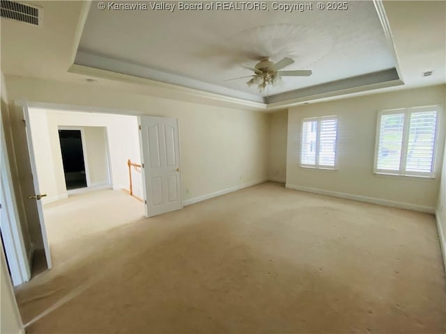 516 Woodbridge Dr, Charleston, WV 25311 - spare room with a raised ceiling, baseboards, ceiling fan, and carpet