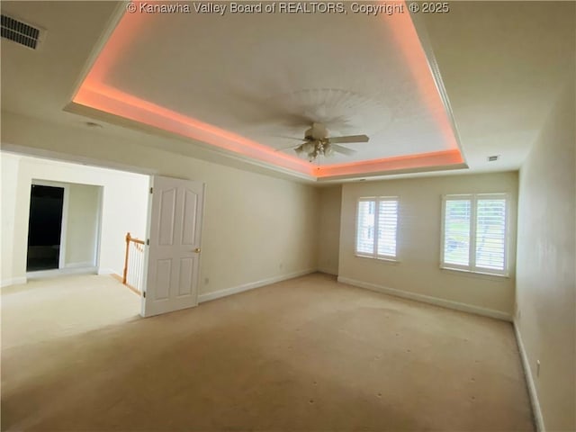 516 Woodbridge Dr, Charleston, WV 25311 - carpeted empty room with a tray ceiling, baseboards, and a ceiling fan