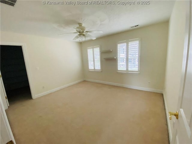 516 Woodbridge Dr, Charleston, WV 25311 - spare room featuring light carpet, ceiling fan, and baseboards