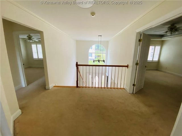 516 Woodbridge Dr, Charleston, WV 25311 - corridor featuring carpet, baseboards, ornamental molding, an upstairs landing, and a chandelier