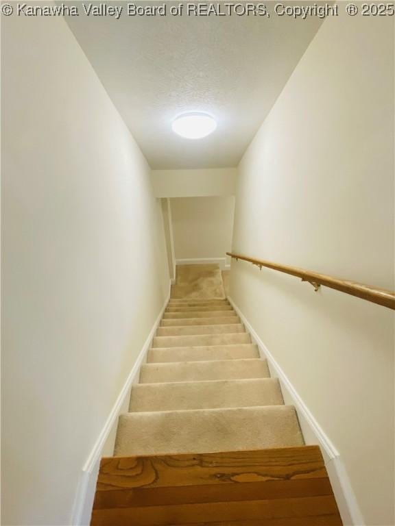 516 Woodbridge Dr, Charleston, WV 25311 - stairs with baseboards and a textured ceiling
