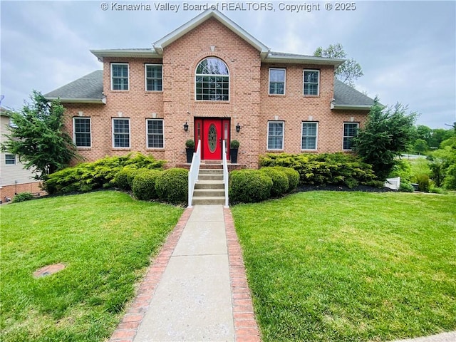 516 Woodbridge Dr, Charleston, WV 25311 - colonial-style house with a front yard and brick siding