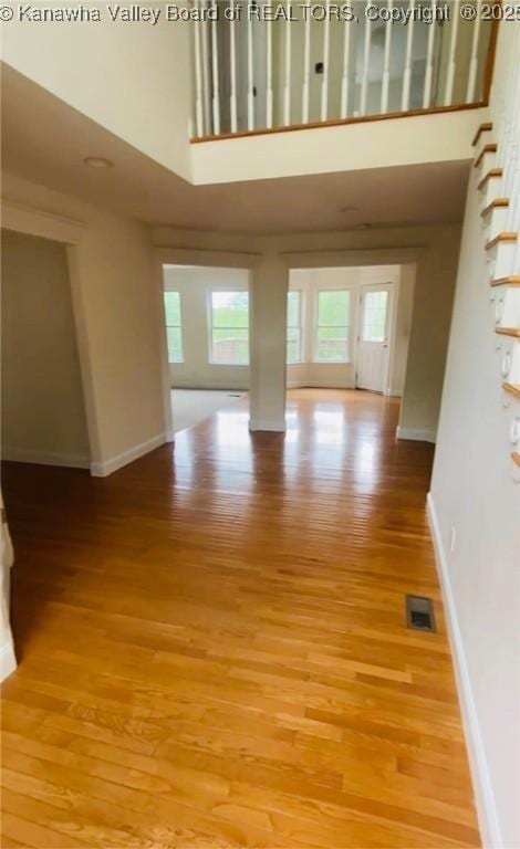 516 Woodbridge Dr, Charleston, WV 25311 - unfurnished room featuring a towering ceiling, light wood-type flooring, and healthy amount of natural light