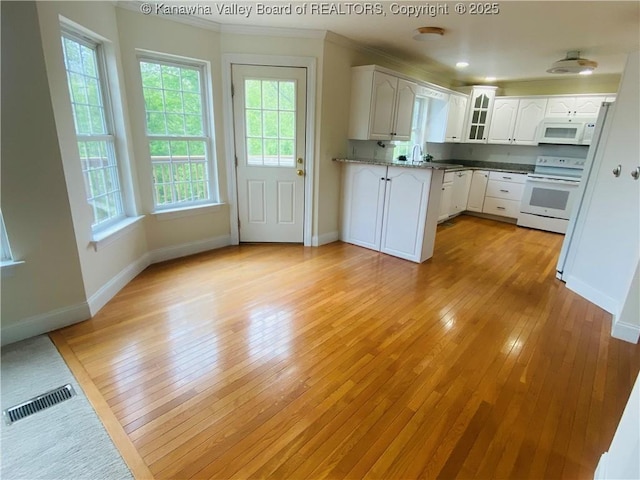516 Woodbridge Dr, Charleston, WV 25311 - kitchen featuring white appliances, plenty of natural light, glass insert cabinets, baseboards, and crown molding