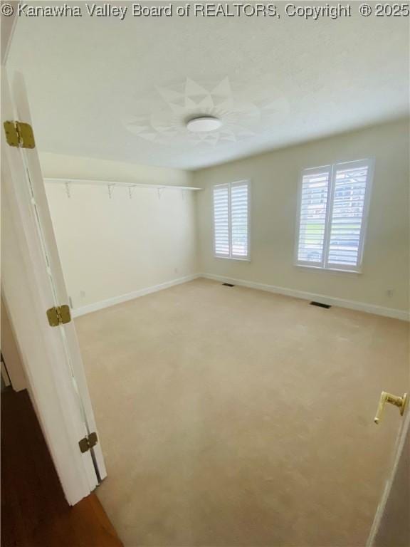 516 Woodbridge Dr, Charleston, WV 25311 - empty room with baseboards and light carpet
