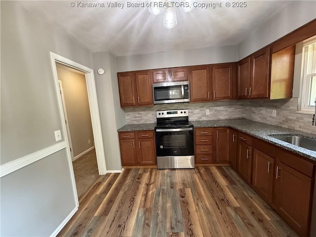 2 Stephanie Ln, Saint Albans, WV 25177 - kitchen featuring stainless steel appliances, a sink, decorative backsplash, and dark wood-style floors