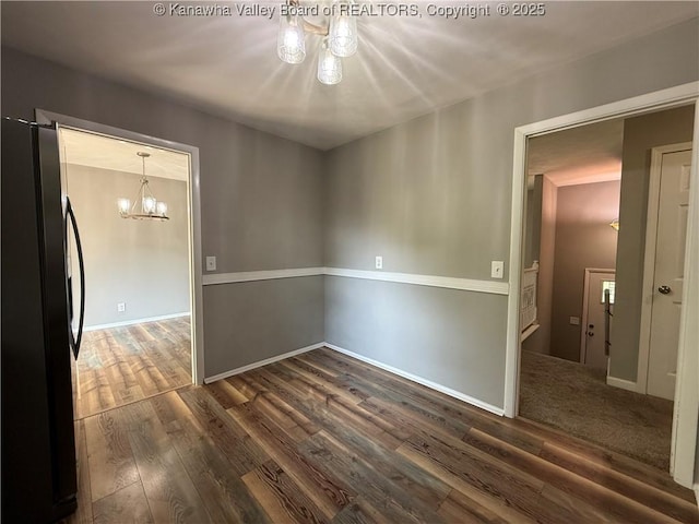 2 Stephanie Ln, Saint Albans, WV 25177 - empty room featuring a chandelier, dark wood finished floors, and baseboards