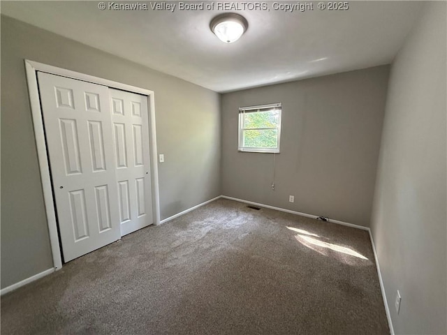 2 Stephanie Ln, Saint Albans, WV 25177 - unfurnished bedroom with carpet, baseboards, and a closet