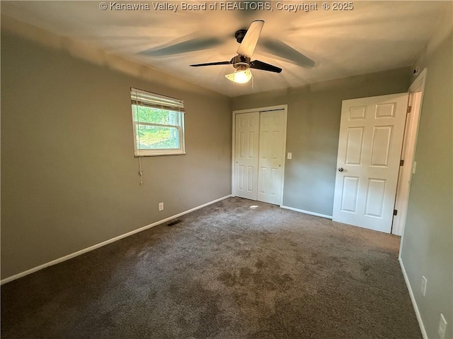 2 Stephanie Ln, Saint Albans, WV 25177 - unfurnished bedroom with baseboards, a closet, dark carpet, and a ceiling fan