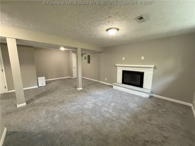 2 Stephanie Ln, Saint Albans, WV 25177 - finished basement with carpet, a fireplace, baseboards, and a textured ceiling