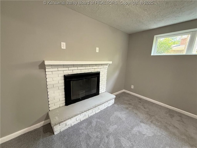 2 Stephanie Ln, Saint Albans, WV 25177 - detailed view of carpet flooring, a brick fireplace, a textured ceiling, and baseboards
