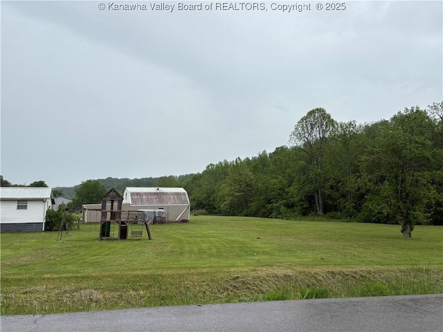 3888-3890 Charleston Rd, Gandeeville, WV 25243 - view of grassy yard featuring an outdoor structure