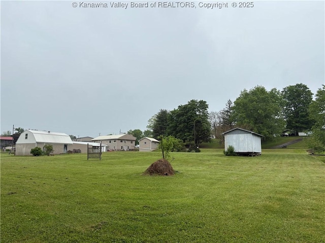 3888-3890 Charleston Rd, Gandeeville, WV 25243 - view of green lawn featuring an outbuilding and a storage shed