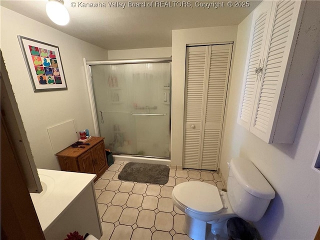 3888-3890 Charleston Rd, Gandeeville, WV 25243 - full bath featuring a closet, toilet, a shower stall, vanity, and tile patterned floors