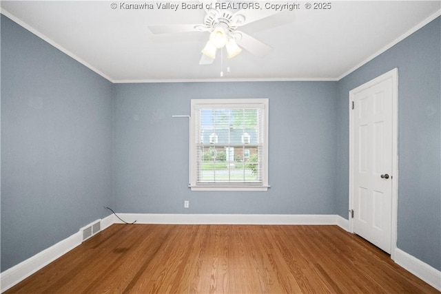 102 49th St SE, Charleston, WV 25304 - spare room with wood finished floors, ornamental molding, baseboards, and ceiling fan