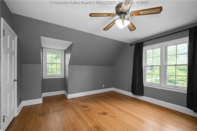 102 49th St SE, Charleston, WV 25304 - additional living space with vaulted ceiling, wood finished floors, baseboards, and a ceiling fan
