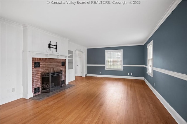 102 49th St SE, Charleston, WV 25304 - unfurnished living room with a fireplace, wood finished floors, crown molding, and baseboards